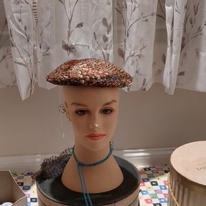 Elegant feather covered Brown Beret
